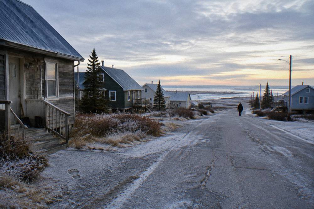 A quiet Churchill street under a wide northern sky